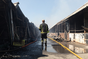 A firefighter is seen inspecting the charred remains of the Pochayna book market following a destructive night attack by Russian forces. On the night of August 16, 2026, a massive Russian air strike on Kyiv caused severe destruction and a large-scale fire at the "Pochaina" book market (formerly known as Petrivka) in the Obolon district. The enemy attack completely burned down several rows of trading pavilions containing books and stationery just ahead of the new school year. Emergency response teams worked at the scene to extinguish the blaze, which spread across a vast area. According to preliminary reports from city authorities, at least three people were injured as a result of the overnight attack. The destroyed marketplace had operated in the capital for nearly 30 years and stood as one of the largest hubs for book trade in Ukraine.