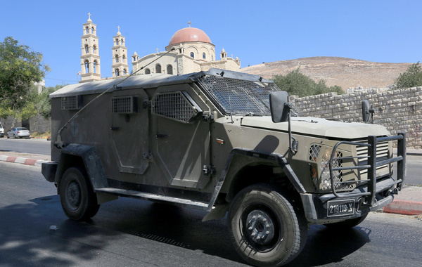 Israeli military vehicle passed by the Greek Orthodox Church during a raid on the Balata refugee camp east of Nablus in the West Bank. Raids and arrests targeting Palestinians in refugee camps located in areas under the control of the Palestinian Authority, headed by President Mahmoud Abbas, have intensified. Local residents reported the arrest of dozens of young Palestinians during raids in the Nablus area and its three camps: Askar, Balata, and Ein, in the northern West Bank.
