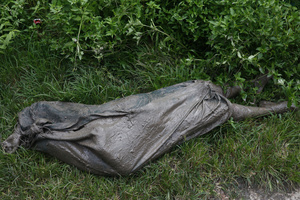 (EDITOR'S NOTE: Image depicts death)
The corpse of a woman is seen on the ground after it was recovered, following a massive flash flood triggered by an avalanche of ice and rock in the upper Lhende River on the Tibetan side. The sudden flood swept through communities along the Bhote Koshi and Trishuli river, destroying homes, roads and bridges and leaving a widespread devastation downstream.
