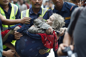 An elderly woman is rescued from buildings and infrastructure that were damaged along the swollen Trishuli River following a massive flash flood triggered by an avalanche of ice and rock in the upper Lhende River on the Tibetan side. The sudden flood swept through communities along the Bhote Koshi and Trishuli river, destroying homes, roads and bridges and leaving a widespread devastation downstream.