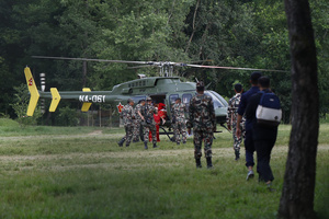 An army chopper rescues people from buildings and infrastructure that were damaged along the swollen Trishuli River following a massive flash flood triggered by an avalanche of ice and rock in the upper Lhende River on the Tibetan side. The sudden flood swept through communities along the Bhote Koshi and Trishuli river, destroying homes, roads and bridges and leaving a widespread devastation downstream.