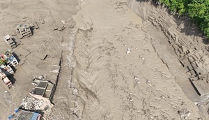 (EDITOR'S NOTE : Image taken with a drone).
An aerial view shows buildings and infrastructure damaged along the swollen Trishuli River following a massive flash flood triggered by an avalanche of ice and rock in the upper Lhende River on the Tibetan side. The sudden flood swept through communities along the Bhote Koshi and Trishuli river, destroying homes, roads and bridges and leaving a widespread devastation downstream.