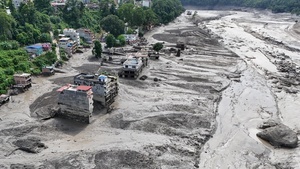 (EDITOR'S NOTE : Image taken with a drone).
An aerial view shows buildings and infrastructure damaged along the swollen Trishuli River following a massive flash flood triggered by an avalanche of ice and rock in the upper Lhende River on the Tibetan side. The sudden flood swept through communities along the Bhote Koshi and Trishuli river, destroying homes, roads and bridges and leaving a widespread devastation downstream.