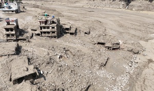 (EDITOR'S NOTE : Image taken with a drone).
An aerial view shows buildings and infrastructure damaged along the swollen Trishuli River following a massive flash flood triggered by an avalanche of ice and rock in the upper Lhende River on the Tibetan side. The sudden flood swept through communities along the Bhote Koshi and Trishuli river, destroying homes, roads and bridges and leaving a widespread devastation downstream.