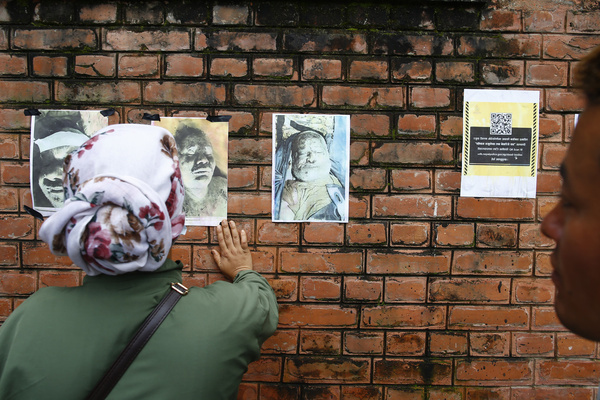 Photographs of missing people seen displayed outside the hospital as families await information about their loved ones with recovered bodies being kept for identification and post-mortem examinations at Tribhuvan University Teaching Hospital. The flooding destroyed roads, bridges and severely disrupted the movement of people and goods across the country. Police said 469 people have been killed and hundreds remain missing as search and rescue operations continue.