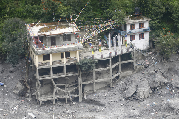 An aerial view from a Nepal Army MI-17 helicopter shows houses destroyed by flash floods in Timure, near the Nepal-China border, in Rasuwa district. The floods have left 1,287 people dead and 5,083 missing, while 13,093 people have been rescued as search and rescue operations continue.