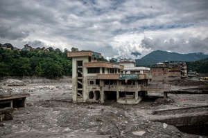 Nuwakot district is almost entirely cut off and paralyzed after catastrophic flash floods, triggered by upstream glacier collapse, annihilated infrastructure, including this crucial asphalt road section, in Trishuli. The widespread erosion and massive surge of mud have fundamentally altered the landscape and severed critical connectivity, isolating survivors across the devastated district and making a mockery of any recovery timeline as thousands face displacement.