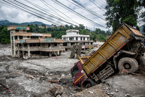 Nuwakot district is almost entirely cut off and paralyzed after catastrophic flash floods, triggered by upstream glacier collapse, annihilated infrastructure, including this crucial asphalt road section, in Trishuli. The widespread erosion and massive surge of mud have fundamentally altered the landscape and severed critical connectivity, isolating survivors across the devastated district and making a mockery of any recovery timeline as thousands face displacement.