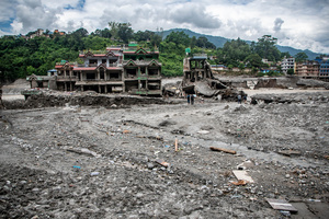 Nuwakot district is almost entirely cut off and paralyzed after catastrophic flash floods, triggered by upstream glacier collapse, annihilated infrastructure, including this crucial asphalt road section, in Trishuli. The widespread erosion and massive surge of mud have fundamentally altered the landscape and severed critical connectivity, isolating survivors across the devastated district and making a mockery of any recovery timeline as thousands face displacement.