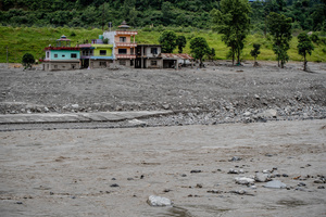 Nuwakot district is almost entirely cut off and paralyzed after catastrophic flash floods, triggered by upstream glacier collapse, annihilated infrastructure, including this crucial asphalt road section, in Trishuli. The widespread erosion and massive surge of mud have fundamentally altered the landscape and severed critical connectivity, isolating survivors across the devastated district and making a mockery of any recovery timeline as thousands face displacement.