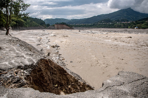 Nuwakot district is almost entirely cut off and paralyzed after catastrophic flash floods, triggered by upstream glacier collapse, annihilated infrastructure, including this crucial asphalt road section, in Trishuli. The widespread erosion and massive surge of mud have fundamentally altered the landscape and severed critical connectivity, isolating survivors across the devastated district and making a mockery of any recovery timeline as thousands face displacement.