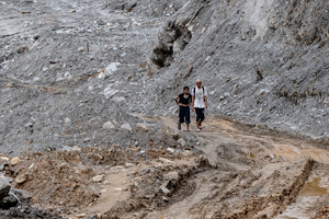Nuwakot district is almost entirely cut off and paralyzed after catastrophic flash floods, triggered by upstream glacier collapse, annihilated infrastructure, including this crucial asphalt road section, in Trishuli. The widespread erosion and massive surge of mud have fundamentally altered the landscape and severed critical connectivity, isolating survivors across the devastated district and making a mockery of any recovery timeline as thousands face displacement.