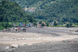 Nuwakot district is almost entirely cutoff and paralyzed after catastrophic flash floods, triggered by upstream glacier collapse, annihilated infrastructure, including this crucial asphalt road section, in Trishuli. The widespread erosion and massive surge of mud have fundamentally altered the landscape and severed critical connectivity, isolating survivors across the devastated district and making a mockery of any recovery timeline as thousands face displacement.