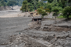 Nuwakot district is almost entirely cutoff and paralyzed after catastrophic flash floods, triggered by upstream glacier collapse, annihilated infrastructure, including this crucial asphalt road section, in Trishuli. The widespread erosion and massive surge of mud have fundamentally altered the landscape and severed critical connectivity, isolating survivors across the devastated district and making a mockery of any recovery timeline as thousands face displacement.