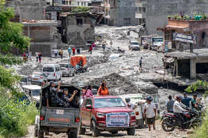 Nuwakot district is almost entirely cut off and paralyzed after catastrophic flash floods, triggered by upstream glacier collapse, annihilated infrastructure, including this crucial asphalt road section, in Trishuli. The widespread erosion and massive surge of mud have fundamentally altered the landscape and severed critical connectivity, isolating survivors across the devastated district and making a mockery of any recovery timeline as thousands face displacement.