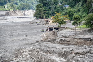 Nuwakot district is almost entirely cut off and paralyzed after catastrophic flash floods, triggered by upstream glacier collapse, annihilated infrastructure, including this crucial asphalt road section, in Trishuli. The widespread erosion and massive surge of mud have fundamentally altered the landscape and severed critical connectivity, isolating survivors across the devastated district and making a mockery of any recovery timeline as thousands face displacement.