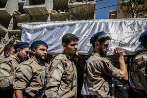 Mourners carry the coffin of Ali Shahrour, a paramedic with Al Risala Scouts, who was killed by an Israeli airstrike in Kfar Roummane, southern Lebanon. At least 4,381 people were killed and 12,402 wounded by Israeli attacks in Lebanon between March 2 and September 7, 2026, according to Lebanon's ministry of health.