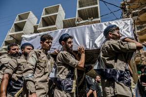 Mourners carry the coffin of Ali Shahrour, a paramedic with Al Risala Scouts, who was killed by an Israeli airstrike in Kfar Roummane, southern Lebanon. At least 4,381 people were killed and 12,402 wounded by Israeli attacks in Lebanon between March 2 and September 7, 2026, according to Lebanon's ministry of health.