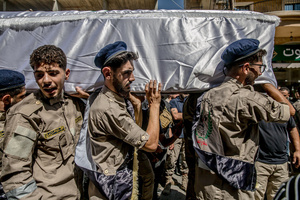 Mourners carry the coffin of Ali Shahrour, a paramedic with Al Risala Scouts, who was killed by an Israeli airstrike in Kfar Roummane, southern Lebanon. At least 4,381 people were killed and 12,402 wounded by Israeli attacks in Lebanon between March 2 and September 7, 2026, according to Lebanon's ministry of health.