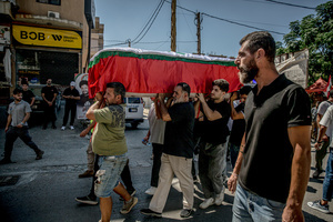 Mourners carry a coffin in Kfar Roummane, southern Lebanon, during the funeral of a family killed by an Israeli airstrike. At least 4,381 people were killed and 12,402 wounded by Israeli attacks in Lebanon between March 2 and September 7, 2026, according to Lebanon's ministry of health.