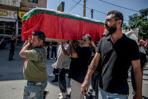 Mourners carry a coffin in Kfar Roummane, southern Lebanon, during the funeral of a family killed by an Israeli airstrike. At least 4,381 people were killed and 12,402 wounded by Israeli attacks in Lebanon between March 2 and September 7, 2026, according to Lebanon's ministry of health.