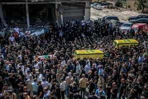 Mourners carry coffins in Kfar Roummane, southern Lebanon, during the funeral of a family killed by an Israeli airstrike. At least 4,381 people were killed and 12,402 wounded by Israeli attacks in Lebanon between March 2 and September 7, 2026, according to Lebanon's ministry of health.