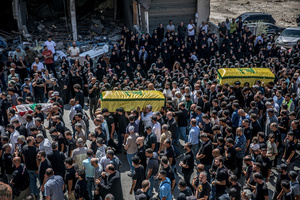 Mourners carry coffins in Kfar Roummane, southern Lebanon, during the funeral of a family killed by an Israeli airstrike. At least 4,381 people were killed and 12,402 wounded by Israeli attacks in Lebanon between March 2 and September 7, 2026, according to Lebanon's ministry of health.