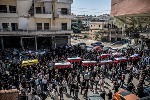 Mourners carry coffins in Kfar Roummane, southern Lebanon, during the funeral of a family killed by an Israeli airstrike. At least 4,381 people were killed and 12,402 wounded by Israeli attacks in Lebanon between March 2 and September 7, 2026, according to Lebanon's ministry of health.