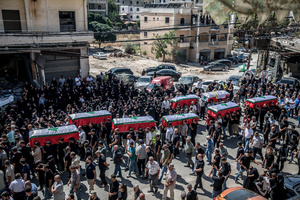 Mourners carry coffins in Kfar Roummane, southern Lebanon, during the funeral of a family killed by an Israeli airstrike. At least 4,381 people were killed and 12,402 wounded by Israeli attacks in Lebanon between March 2 and September 7, 2026, according to Lebanon's ministry of health.