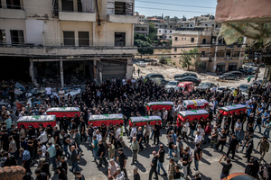 Mourners carry coffins in Kfar Roummane, southern Lebanon, during the funeral of a family killed by an Israeli airstrike. At least 4,381 people were killed and 12,402 wounded by Israeli attacks in Lebanon between March 2 and September 7, 2026, according to Lebanon's ministry of health.