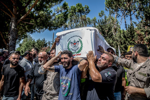 Mourners carry the coffin of Ali Shahrour, a paramedic with Al Risala Scouts, who was killed by an Israeli airstrike in Kfar Roummane, southern Lebanon. At least 4,381 people were killed and 12,402 wounded by Israeli attacks in Lebanon between March 2 and September 7, 2026, according to Lebanon's ministry of health.