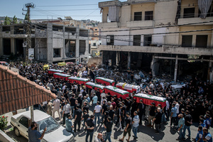 Mourners carry coffins in Kfar Roummane, southern Lebanon, during the funeral of a family killed by an Israeli airstrike. At least 4,381 people were killed and 12,402 wounded by Israeli attacks in Lebanon between March 2 and September 7, 2026, according to Lebanon's ministry of health.