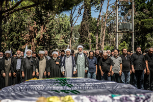 Mourners pray in Kfar Roummane, southern Lebanon, during the funeral of a family killed by an Israeli airstrike. At least 4,381 people were killed and 12,402 wounded by Israeli attacks in Lebanon between March 2 and September 7, 2026, according to Lebanon's ministry of health.