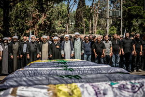 Mourners pray in Kfar Roummane, southern Lebanon, during the funeral of a family killed by an Israeli airstrike. At least 4,381 people were killed and 12,402 wounded by Israeli attacks in Lebanon between March 2 and September 7, 2026, according to Lebanon's ministry of health.