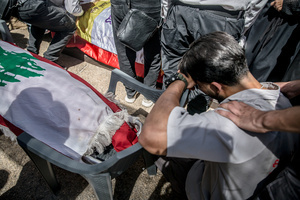 (EDITORS NOTE: Image depicts death)
A man cries beside the body of a child in Kfar Roummane, southern Lebanon, during the funeral of a family killed by an Israeli airstrike. At least 4,381 people were killed and 12,402 wounded by Israeli attacks in Lebanon between March 2 and September 7, 2026, according to Lebanon's ministry of health.