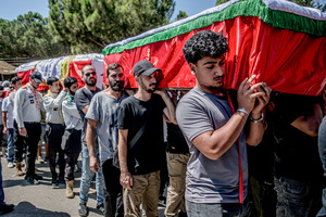 Mourners carry coffins in Kfar Roummane, southern Lebanon, during the funeral of a family killed by an Israeli airstrike. At least 4,381 people were killed and 12,402 wounded by Israeli attacks in Lebanon between March 2 and September 7, 2026, according to Lebanon's ministry of health.
