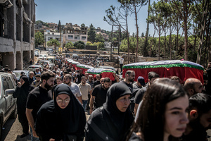 Mourners carry coffins in Kfar Roummane, southern Lebanon, during the funeral of a family killed by an Israeli airstrike. At least 4,381 people were killed and 12,402 wounded by Israeli attacks in Lebanon between March 2 and September 7, 2026, according to Lebanon's ministry of health.