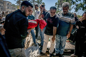 (EDITORS NOTE: Image depicts death)
A months-old baby is buried in Kfar Roummane, southern Lebanon, during the funeral of a family killed by an Israeli airstrike. At least 4,381 people were killed and 12,402 wounded by Israeli attacks in Lebanon between March 2 and September 7, 2026, according to Lebanon's ministry of health.