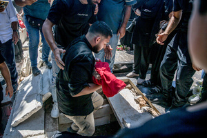 (EDITORS NOTE: Image depicts death)
A months-old baby is buried in Kfar Roummane, during the funeral of a family killed by an Israeli airstrike. At least 4,381 people were killed and 12,402 wounded by Israeli attacks in Lebanon between March 2 and September 7, 2026, according to Lebanon's ministry of health.