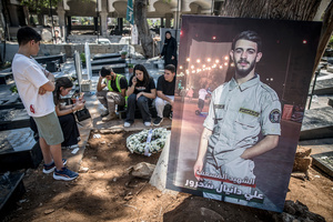 A poster commemorating paramedic Ali Shahrour seen in front of his grave in Kfar Roummane, southern Lebanon. At least 4,381 people were killed and 12,402 wounded by Israeli attacks in Lebanon between March 2 and September 7, 2026, according to Lebanon's ministry of health.
