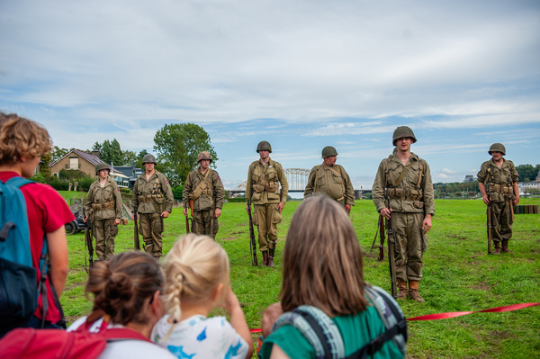 Families are seen observing the WW II reenactors. This month marks 82 years since the troops of the American 82nd Airborne Division crossed the Waal River in Nijmegen to liberate the city from the German occupiers. A World War II encampment was recreated on the riverbank, where reenactors took visitors back in time with living history.
