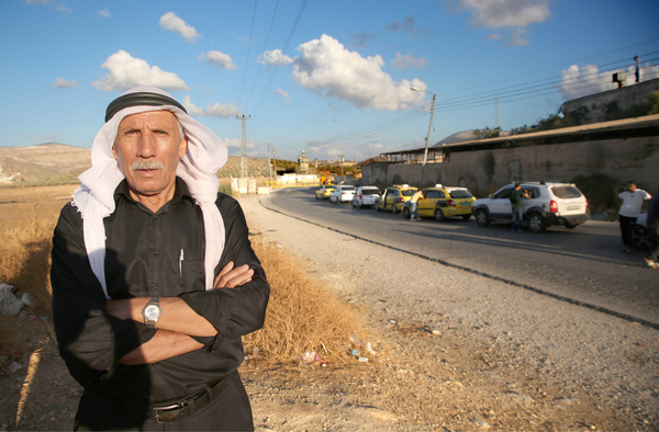 An elderly Palestinian man waits at the Israeli "Beit Furik" checkpoint, east of Nablus in the West Bank, after the Israeli army closed it during a protest organized by Jewish settlers. The protest followed the death of a settler from the nearby settlement of Yitzhar in a car-ramming attack in the city of Hadera. Jewish settlers gathered, blocked Palestinian roads, assaulted residents, and threw stones at Palestinian vehicles, resulting in a Palestinian girl being shot by settlers south of Nablus.