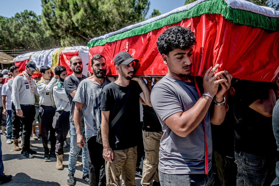 Mourners carry coffins in Kfar Roummane, southern Lebanon, during the funeral of a family killed by an Israeli airstrike. At least 4,381 people were killed and 12,402 wounded by Israeli attacks in Lebanon between March 2 and September 7, 2026, according to Lebanon's ministry of health.