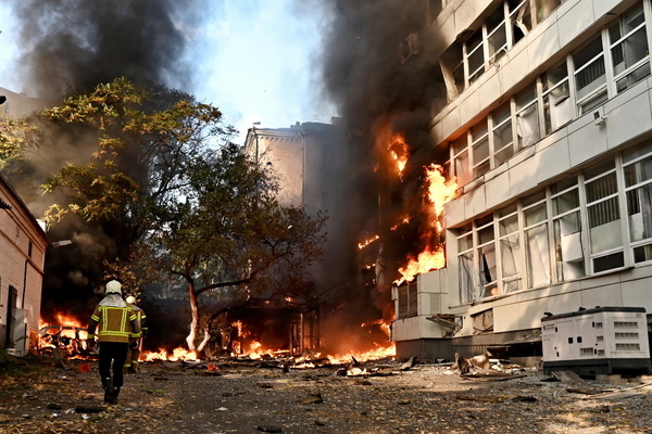 Firefighters work at the site of a Russian jet-powered drone strike, amid Russia's attack on Ukraine. The building of the private medical clinic Dobrobut burns following a second Russian drone strike on central Kyiv, approximately one hour after a projectile hit a residential building in the city center on September 28, 2026 in Kyiv, Ukraine. The strike came shortly after separate drone strike on the Academy of Sciences building in Kyiv's historic center.