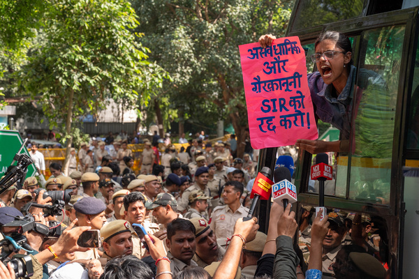 Member of the student wing of the Communist Party of India (CPI) shout slogans inside a bus after being detained by police during a protest against India’s Chief Election Commissioner Gyanesh Kumar. The protest was held on the birth anniversary of Mahatma Gandhi near Jantar Mantar, New Delhi. The current controversy centres on the revision and verification of electoral rolls, including the Special Intensive Revision (SIR). According to Indian political analysts, around 130 million voters’ names have been removed from electoral rolls during the recent SIR process. The reasons behind the removal of voters’ names have become a major political controversy. As a result, opposition political parties have been protesting against India’s Chief Election Commissioner, Gyanesh Kumar.