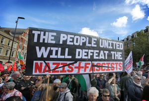 Protesters seen holding a sign saying ‘The People United Will Defeat The Nazis. Ans Fascists’ during the rally. The 90th anniversary of the Battle of Cable Street is commemorated on Sunday 4 October 2026 in the east end of London. Despite the make-up having changed greatly over the last nine decades, thousands still marched through the streets to oppose Fascism and Zionism. In 1936, over 100,000 Jewish residents, Irish dockers, trade unionists, and local working-class communities stood shoulder to shoulder and repelled Sir Oswald Mosley's British Union of Fascists.