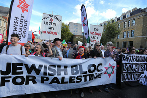 Protesters seen marching and chanting slogans behind a banner saying ‘Jewish Bloc For Palestine’ during the rally. The 90th anniversary of the Battle of Cable Street is commemorated on Sunday 4 October 2026 in the east end of London. Despite the make-up having changed greatly over the last nine decades, thousands still marched through the streets to oppose Fascism and Zionism. In 1936, over 100,000 Jewish residents, Irish dockers, trade unionists, and local working-class communities stood shoulder to shoulder and repelled Sir Oswald Mosley's British Union of Fascists.