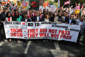 Supporters from diverse backgrounds seen marching behind a 90th anniversary banner during the rally. The 90th anniversary of the Battle of Cable Street is commemorated on Sunday 4 October 2026 in the east end of London. Despite the make-up having changed greatly over the last nine decades, thousands still marched through the streets to oppose Fascism and Zionism. In 1936, over 100,000 Jewish residents, Irish dockers, trade unionists, and local working-class communities stood shoulder to shoulder and repelled Sir Oswald Mosley's British Union of Fascists.