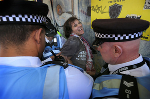 A protester is arrested after a disagreement with a member of pro-Israel lobby group Campaign Against Antisemitism outside the Tower Hamlets town hall during the rally. The 90th anniversary of the Battle of Cable Street is commemorated on Sunday 4 October 2026 in the east end of London. Despite the make-up having changed greatly over the last nine decades, thousands still marched through the streets to oppose Fascism and Zionism. In 1936, over 100,000 Jewish residents, Irish dockers, trade unionists, and local working-class communities stood shoulder to shoulder and repelled Sir Oswald Mosley's British Union of Fascists.
