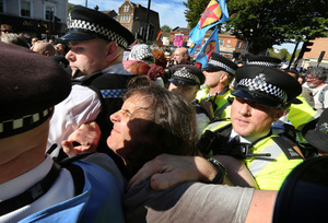 A protester is arrested after a disagreement with a member of pro-Israel lobby group Campaign Against Antisemitism outside the Tower Hamlets town hall during the rally. The 90th anniversary of the Battle of Cable Street is commemorated on Sunday 4 October 2026 in the east end of London. Despite the make-up having changed greatly over the last nine decades, thousands still marched through the streets to oppose Fascism and Zionism. In 1936, over 100,000 Jewish residents, Irish dockers, trade unionists, and local working-class communities stood shoulder to shoulder and repelled Sir Oswald Mosley's British Union of Fascists.